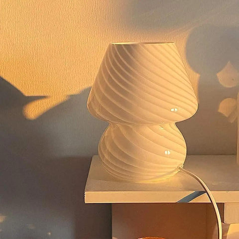 Mushroom Glass Desk Lamp With White Stripes, Vintage Murano Hand-Blown Style, on a shelf, warm light illuminating the background.