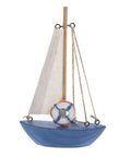 Mediterranean Wooden Sailboat Model Decor with blue hull and cloth sail, nautical ornament for home and office display.