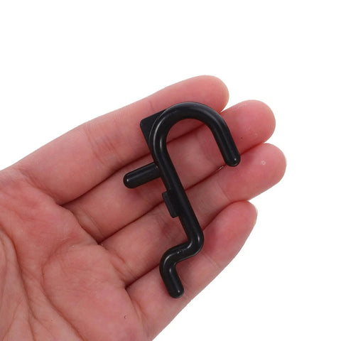 150 Pcs Plastic Pegboard Hooks For Tool Storage And Small Kitchen Supplies, Heavy Duty Repositionable Pegboard Hangers With Easy Assembly, Ideal For Retail Displays And Garage Organization, Studio Gear Black pegboard hook in hand