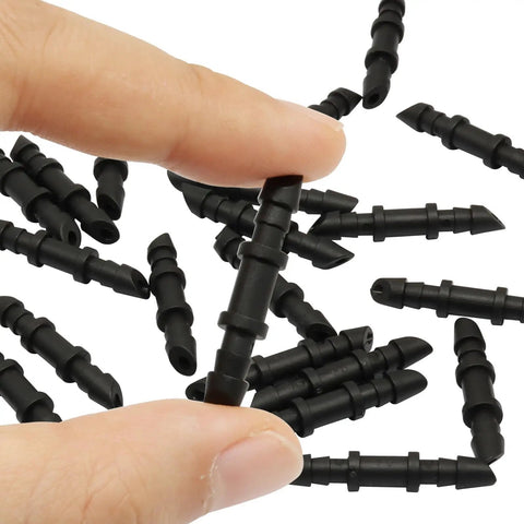 Drip Irrigation Barbed Fittings Kit With 120 Pieces 1 Quarter Inch Connectors closeup in hand