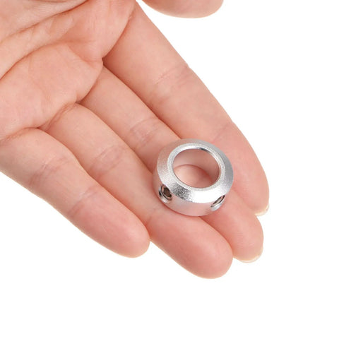 4 Pack 12mm Bore Aluminum Shaft Collars With Set Screws, 20mm Outer Diameter, 8mm Wide, held in hand for scale