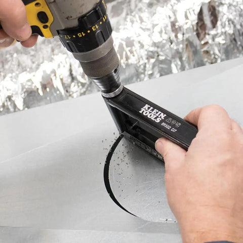 Using Go-To Adjustable Hole Cutter 2 to 12 Inch for sheet metal cuts, drilling a precise hole in 24 gauge steel panel.