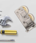 Heavy Duty Stainless Steel Sliding Door Roller With Double Bearing Track Pulley and Smooth Sailing Glide For Patio Doors and Window Screens on a work surface.