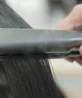 Extreme Nano Titanium Hair Straightener With Floating Plates, Fast Heating, Frizzy Hair Fix in use on dark hair