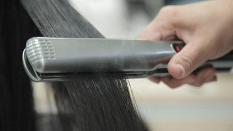 Extreme Nano Titanium Hair Straightener With Floating Plates, Fast Heating, Frizzy Hair Fix in use on dark hair