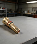 Copper Gas Diffuser Nozzles For MIG Welding Guns 4335 Style on a workshop table, showing detailed construction