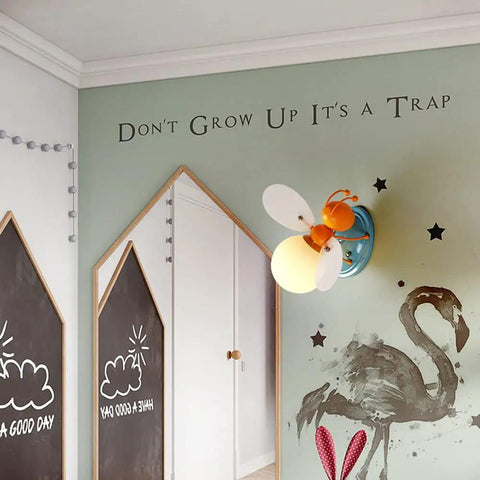 Bee Shaped Kids Wall Light With Glass Shade Cute Sconce For Girls And Boys Bedroom Hardwired Night Light UL Listed Socket And Wire Easy Install Modern Decor For Reading And Playtime mounted on a green wall
