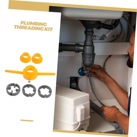 Plumber using Hardcore Pipe Threader Kit for plumbing projects under a kitchen sink, showing tools and installation process.