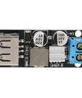 Slick And Solid Dc Dc Buck Converter Step Down Voltage Regulator Module 6V To 32V To 5V With Usb Quick Charge Port and screw terminals on a black PCB.