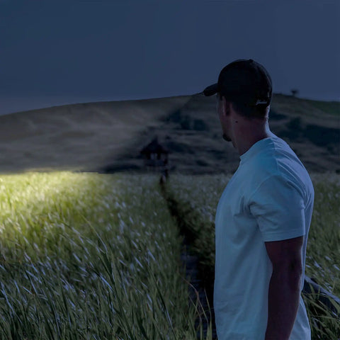 Man using 10 Pack Dope Mini Pocket Flashlights With Clip Penlight Style Tactical Beams for nighttime adventure.