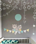 White Bubble Garland Set 26.4 Feet Of Transparent PVC Bubbles For Mermaid Ocean Party Decor in a nursery with bear decals.