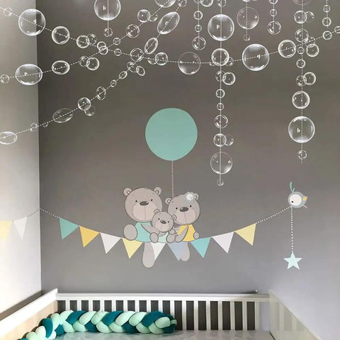 White Bubble Garland Set 26.4 Feet Of Transparent PVC Bubbles For Mermaid Ocean Party Decor in a nursery with bear decals.