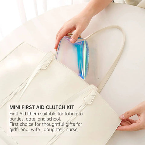 Everyday Mini First Aid Kit For Women And Moms with 27 essentials, visible in a shiny clutch inside a white handbag, ideal for travel.