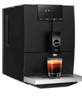 One Touch Fully Automatic Black Coffee Maker Ena Model with brewed coffee in glass, matte black finish and sleek design.