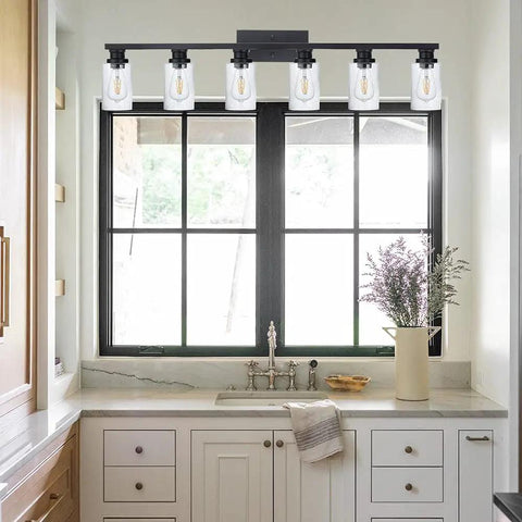 4 Light Vintage Bath Vanity Light in Matte Black Finish with Seeded Glass Shade above bathroom sink and window