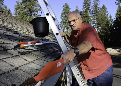Heavy Duty Ladder Stabilizer For Safer Roof Access And Gutter Protection Fits Most Ladders 19 Inch Safe Work Area in use by man