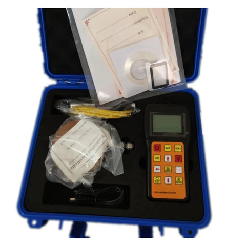 Portable Digital Leeb Hardness Tester With Tough Compact Build And No Sweat One Grip Operation For All Metal Alloys Quick Multi Scale Readings Like HRC HRB HV Totally Legit For Every Field Pro in a protective case with accessories.