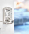 SmartCode 917 Keypad Keyless Entry Lever Deadbolt in satin nickel installed on a door with Tustin handle, electronic lock visible