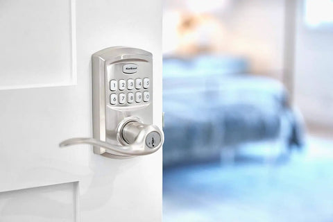 SmartCode 917 Keypad Keyless Entry Lever Deadbolt in satin nickel installed on a door with Tustin handle, electronic lock visible