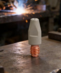 Coated Copper Welding Nozzle For High Precision Automotive And Metal Fabrication on metal surface in workshop