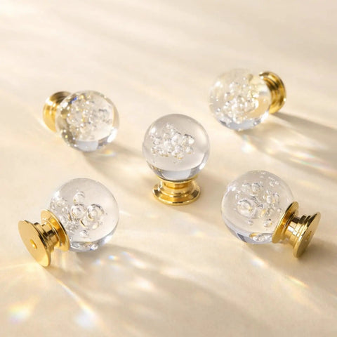 Crystal Bubble Ball Cabinet Knobs 12 Pack Dope Transparent Sphere Handles With Gold Aluminum Base on beige surface