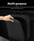 Badass Waterproof Leather Car Jumper Cable Bag Portable Trunk Organizer For EV Charging Cords And Garden Hoses showing a hand opening bag.