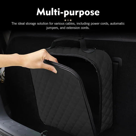 Badass Waterproof Leather Car Jumper Cable Bag Portable Trunk Organizer For EV Charging Cords And Garden Hoses showing a hand opening bag.
