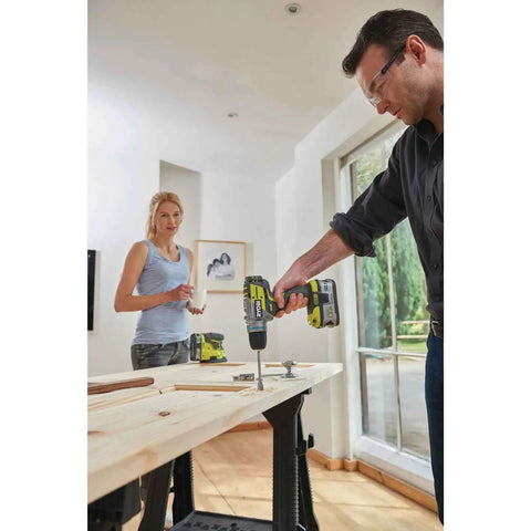 Professional Grade Brushless Percussion Drill With Killer Torque And All Metal Chuck 18 Volt Cordless Power Tool in use on wooden surface.