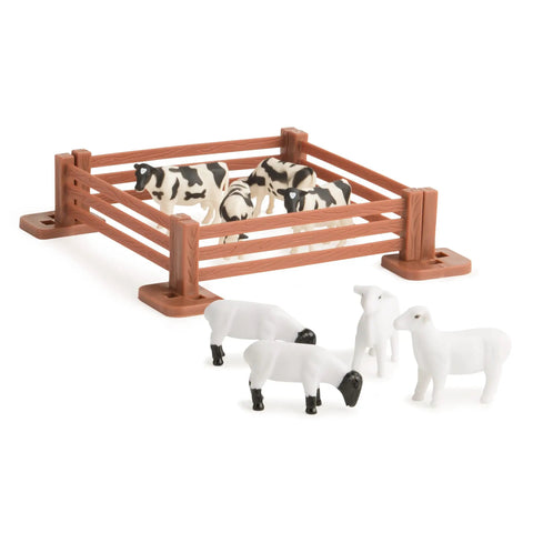John Deere Tractor Toys Value Set with barnyard animals in fence and outdoors, part of 18 die-cast vehicles playset for kids.