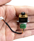 Front view of 15mm DC micro stepper motor with brass gearbox, black housing, 4-wire cable, and green PCB connector