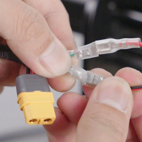 Close-up of hands connecting wires in Dope 500W CNC Spindle Motor Kit with Adjustable Speed for DIY Engraving and Router Milling.