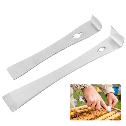 Two Piece Pry Bar Scraper Set With 7-1/4 Inch And 9-1/4 Inch Stainless Steel Flat Pry Bars With Built In Nail Puller shown above a hand using them for repair