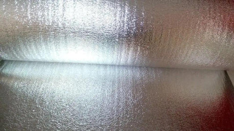 Close-up of Heavy Duty Reflective Foil Radiant Barrier Roof Underlayment 4 Ft X 250 Ft 1000 Sq Ft material with shiny surface.