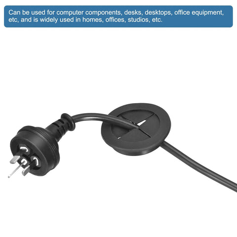 Two Pack 32mm Desk Grommets Flexible Rubber Cable Pass Through Hole Covers in matte black with power cord, for office organization.