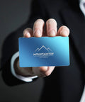 Person holding Colorful Aluminum Metal Business Card Blanks Pack Of 200 For Laser Engraving And DIY Cards, blue card with logo.
