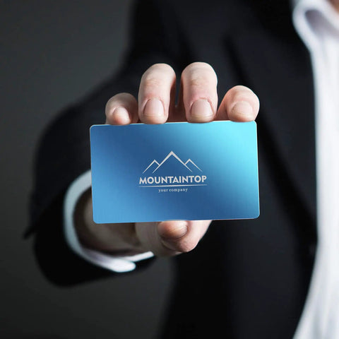 Person holding Colorful Aluminum Metal Business Card Blanks Pack Of 200 For Laser Engraving And DIY Cards, blue card with logo.