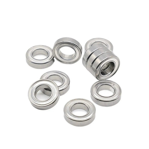 Amp Up Your Gear With Double Sealed Deep Groove Ball Bearings 10 Pack Size 6700ZZ 10X15X4mm steel bearings arranged in a group.