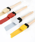 Kick Ass 1 Inch Foam Paint Brushes 12 Pack with painted tips in various colors for Mod Podge, wood staining, and crafts.