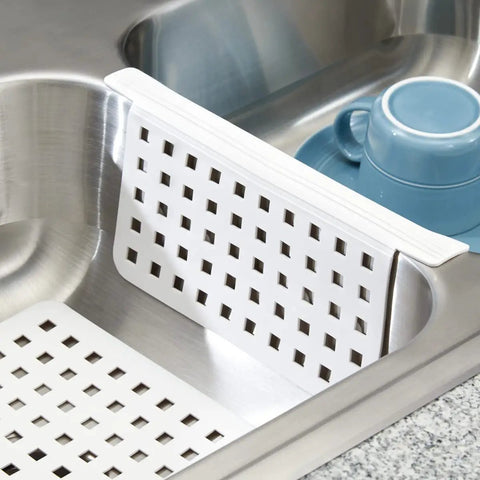Kitchen Sink Mat Protector 11 By 12 Inches White Open Grid Plastic Sink Mat For Dish Protection In Kitchen Bathroom And Laundry Sinks The Euro Collection shown in use over a sink divider.