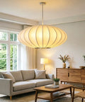 AFSEMOS 20" Japanese Wabi Sabi Pendant Light Silk Hanging Lantern Lamp above a cozy living room setup.
