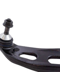 Close-up of lower control arm and ball joint from beefed up front steering and suspension kit for 2010-2012 Ford Taurus and Lincoln MKS.