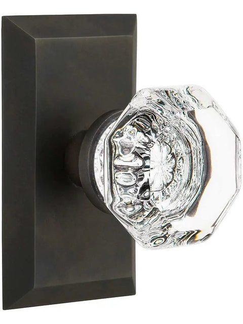 Close-up of Studio Plate And Waldorf Crystal Door Knob Set for vintage vibe with crisp edges and classic hardware.