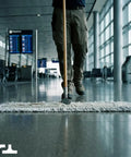 Person using Straight Up Heavy Duty 36 Inch Commercial Dust Mop And Floor Sweeper With Thick Cotton Head And Solid Wood Handle.
