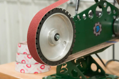 EdgeCore Ceramic Grinding Sanding Belts 2x72 Inch Coarse/Medium Grit displayed on belt sander for metal wood finishing