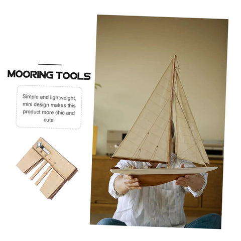 Person holding scale model sailboat with Wooden Mooring Tool for DIY Sailing Model Kits Dope Lightweight Display Tool