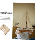 Person holding a sailboat model with Wooden Mooring Tools Set for Ship Building Models, Sailboat Craft Supplies beside them.