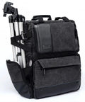 Big Capacity Laptop And DSLR Video Camera Backpack With All Weather Cover, side view with tripod in quick-access pocket.