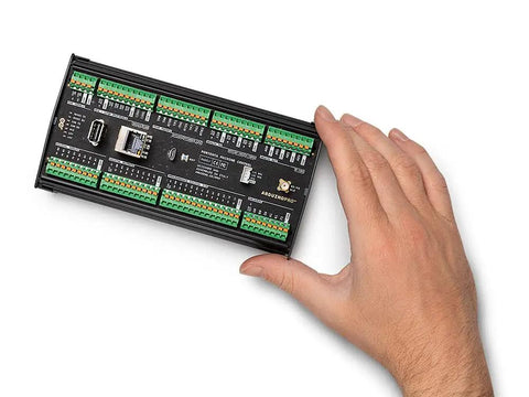 Hand holding Portenta Machine Control Industrial Beast Controller for automation robotics and IoT with dual-core processor.