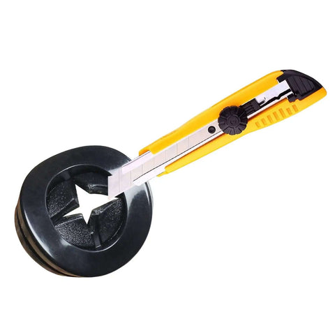 Eight Pack One And A Half Inch Drill Hole Rubber Grommets Black with yellow cutter knife for wire protection in automotive wiring projects
