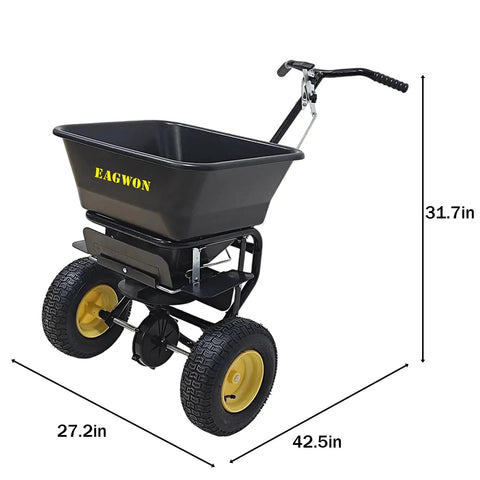 Pro Grade Walk Behind Broadcast Spreader For All Season Lawn Care And Commercial And Residential Use With 100Lb Hopper And 13 Inch All Terrain Pneumatic Tires Enclosed Gearbox Grate Cover Spreads Seed Fertilizer Salt And Snow Melt Across Large Areas, shown in black with measurement details.